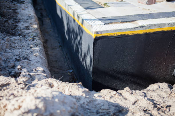 Professional Basement Waterproofing technician working in Alvordton, OH